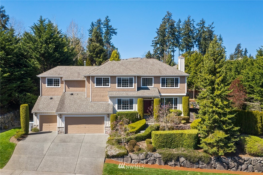 2009 Lyons Avenue Northeast Renton, WA 98059 - Photo 1 of 35 a front view of a residential houses with yard and green space