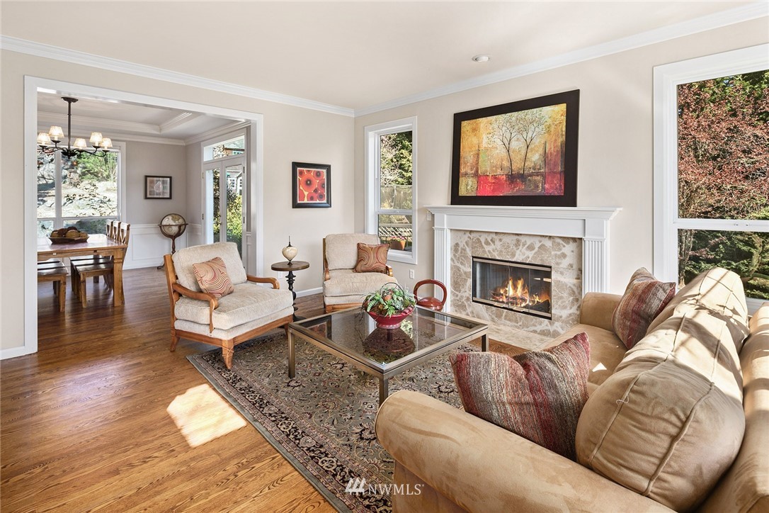 2009 Lyons Avenue Northeast Renton, WA 98059 - Photo 2 of 35 a living room with furniture a flat screen tv and a fireplace