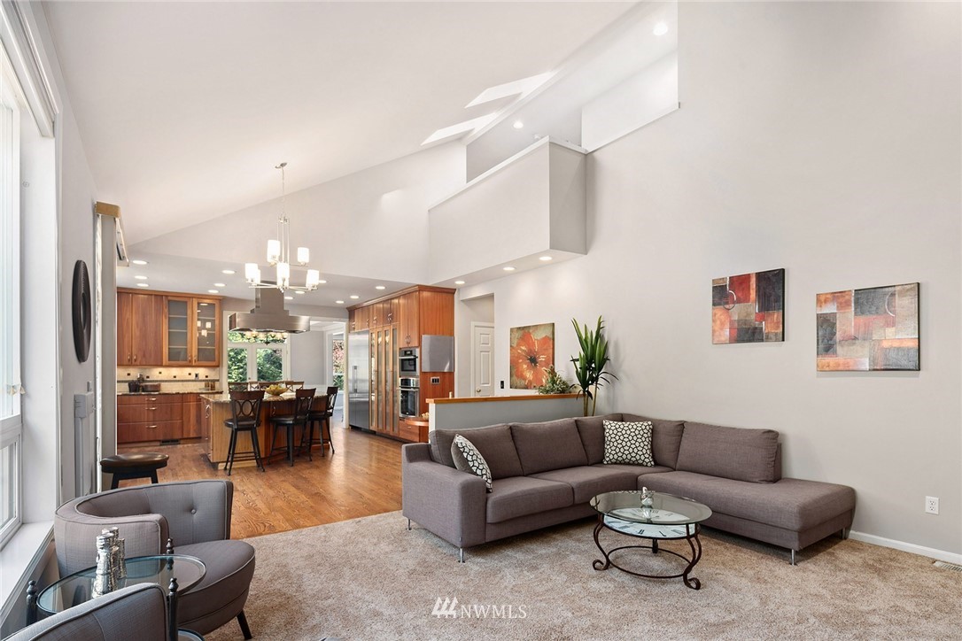 2009 Lyons Avenue Northeast Renton, WA 98059 - Photo 11 of 35 a living room with furniture kitchen view and a chandelier