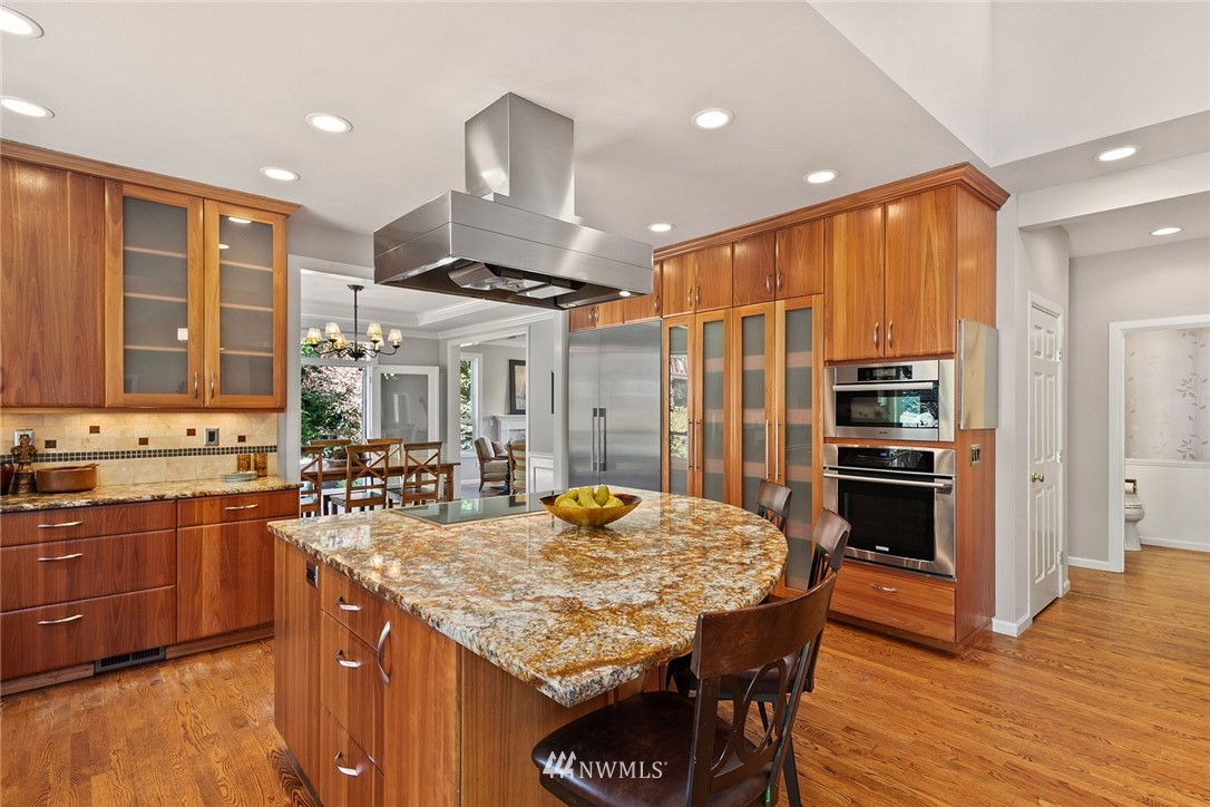 2009 Lyons Avenue Northeast Renton, WA 98059 - Photo 14 of 35 a kitchen with stainless steel appliances granite countertop a stove refrigerator and cabinets