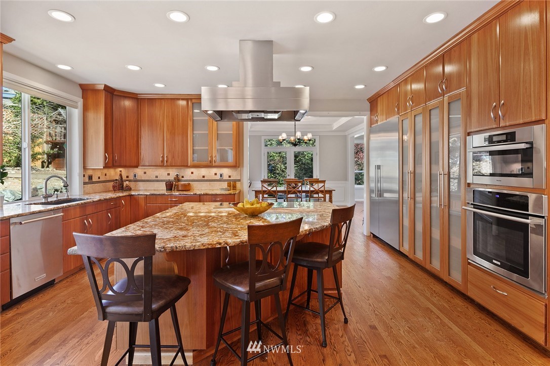 2009 Lyons Avenue Northeast Renton, WA 98059 - Photo 15 of 35 a large kitchen with a table and chairs