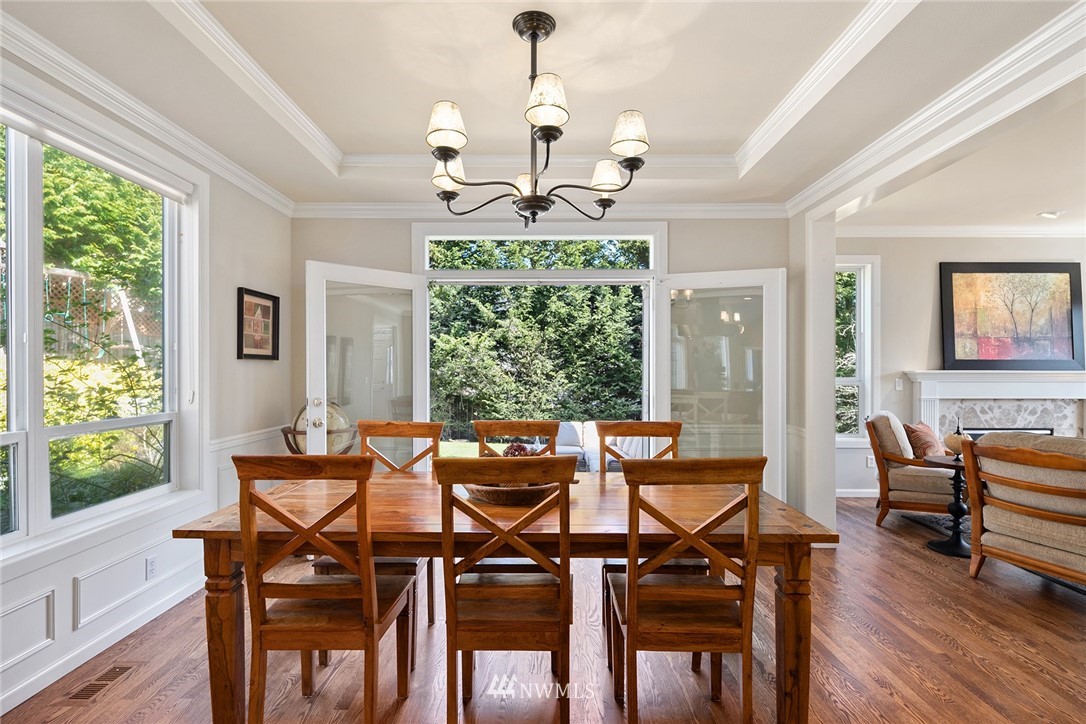 2009 Lyons Avenue Northeast Renton, WA 98059 - Photo 17 of 35 a view of a dining room with furniture window and wooden floor