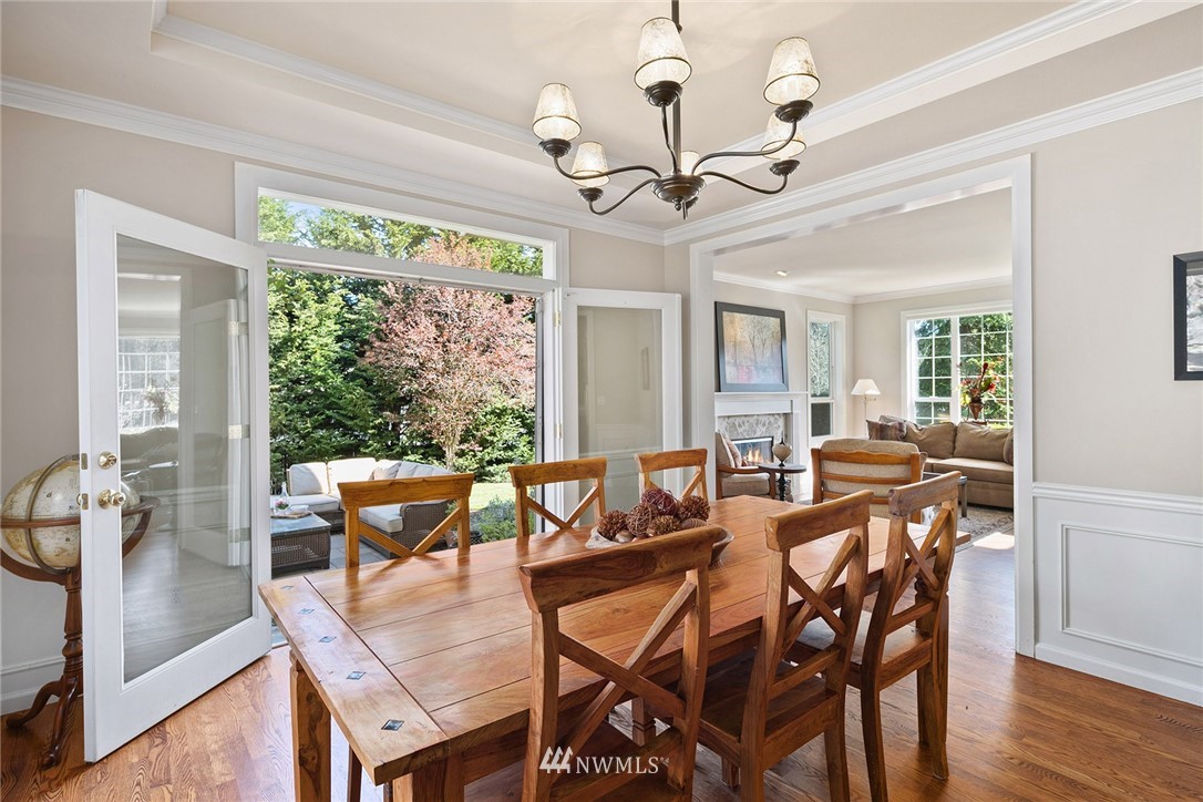 2009 Lyons Avenue Northeast Renton, WA 98059 - Photo 18 of 35 a view of a dining room with furniture wooden floor and chandelier