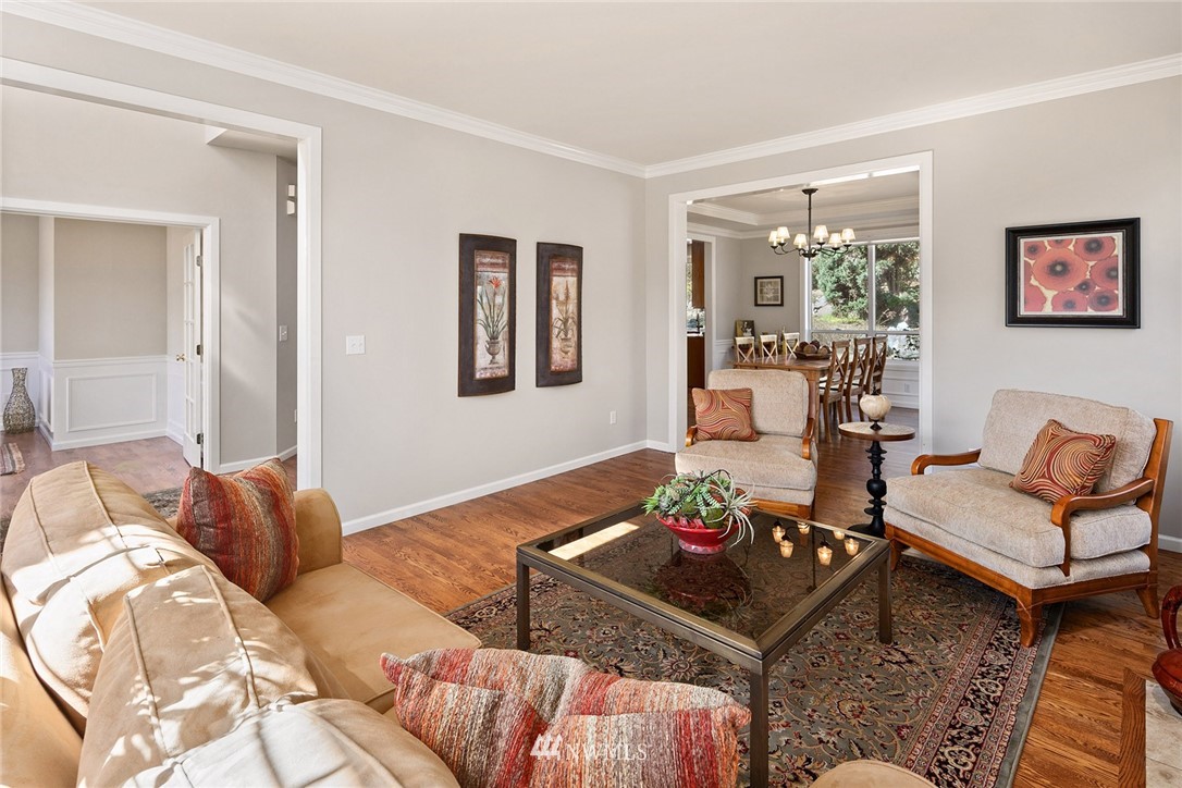 2009 Lyons Avenue Northeast Renton, WA 98059 - Photo 23 of 35 a living room with furniture potted plant and a window