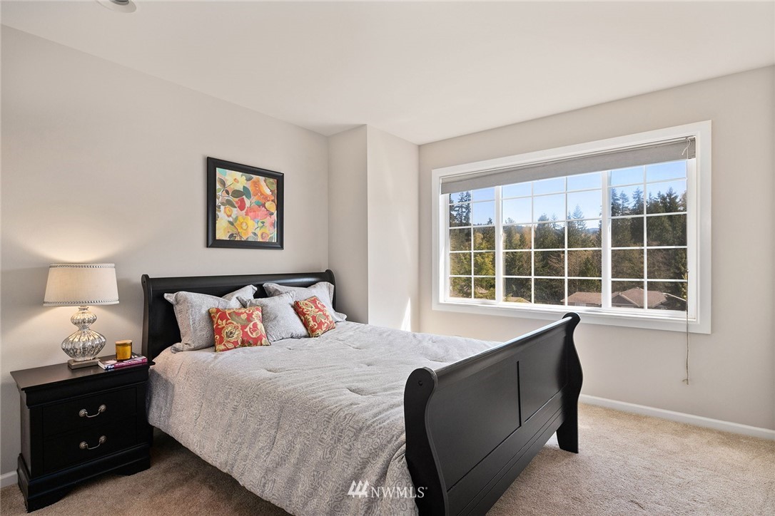 2009 Lyons Avenue Northeast Renton, WA 98059 - Photo 29 of 35 a bedroom with a bed and a window