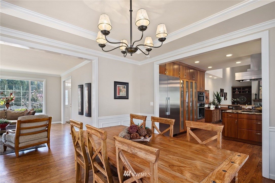 2009 Lyons Avenue Northeast Renton, WA 98059 - Photo 4 of 35 a view of a dining room and livingroom with furniture wooden floor a chandelier