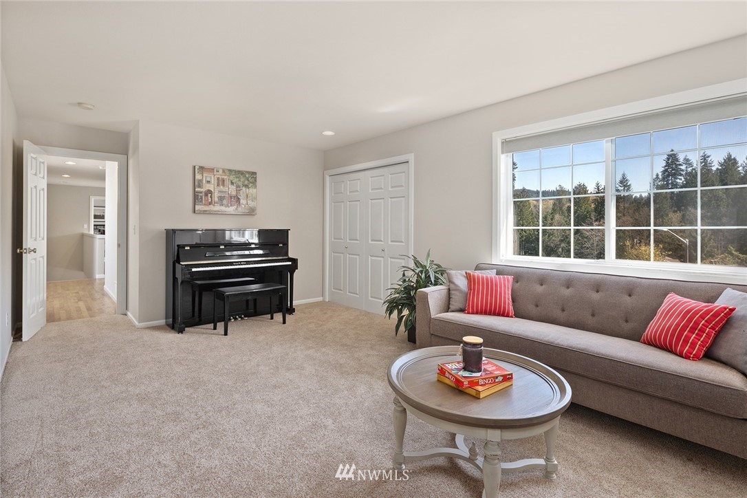 2009 Lyons Avenue Northeast Renton, WA 98059 - Photo 32 of 35 a living room with furniture a piano and a window