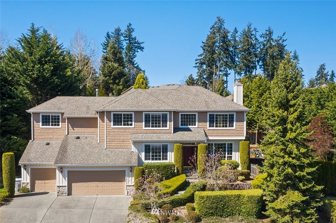 2009 Lyons Avenue Northeast Renton, WA 98059 - Photo 34 of 35 a front view of a house with a garden