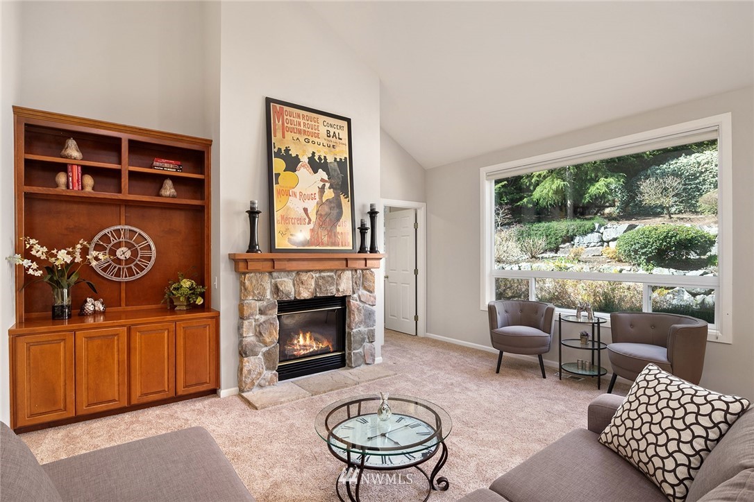 2009 Lyons Avenue Northeast Renton, WA 98059 - Photo 9 of 35 a living room with furniture a window and a fireplace