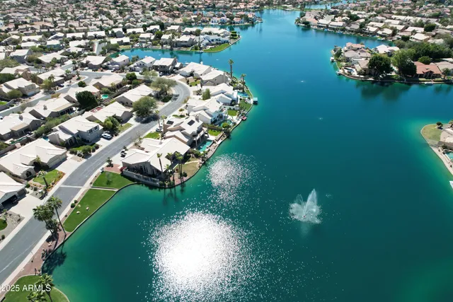 an aerial view of a house a yard basket ball court