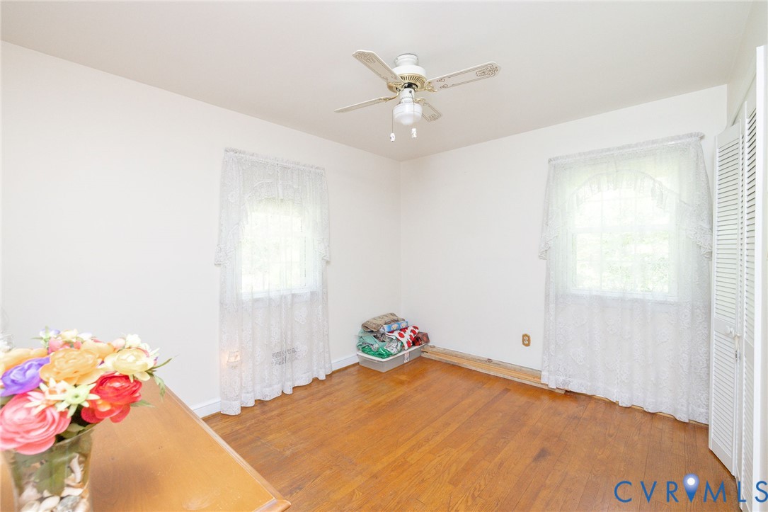 7035 Conifer Road Richmond, VA 23237 - Photo 12 of 38 Spare room with ceiling fan and light wood-style f
