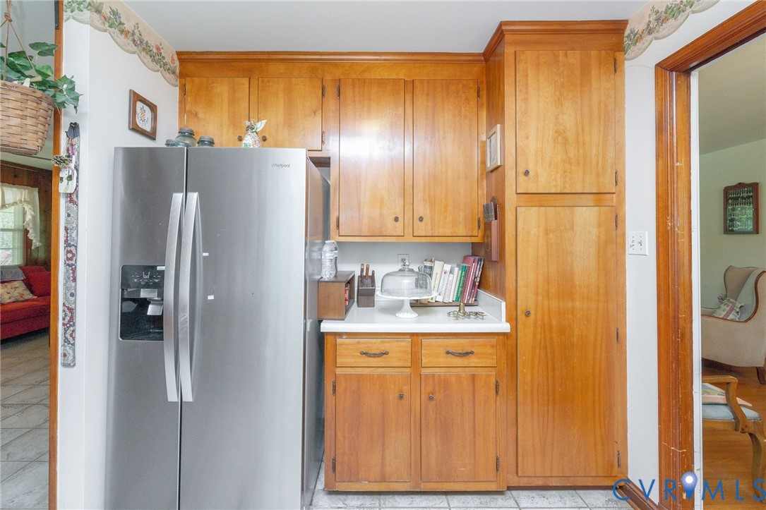 7035 Conifer Road Richmond, VA 23237 - Photo 23 of 38 Kitchen featuring stainless steel fridge, light co