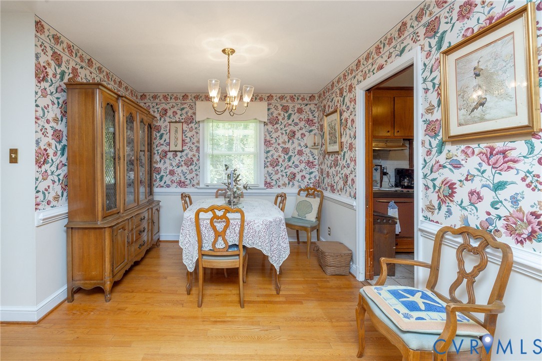 7035 Conifer Road Richmond, VA 23237 - Photo 25 of 38 Dining space featuring hanging lights and light wo