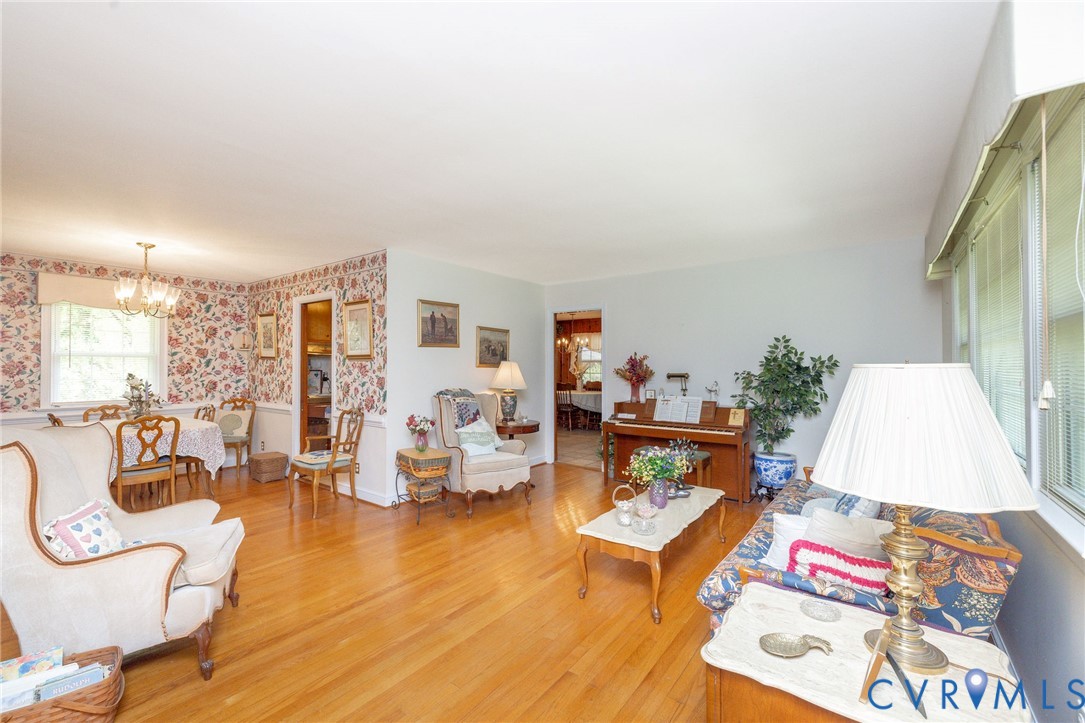 7035 Conifer Road Richmond, VA 23237 - Photo 31 of 38 Living room with wallpapered walls, light wood-sty