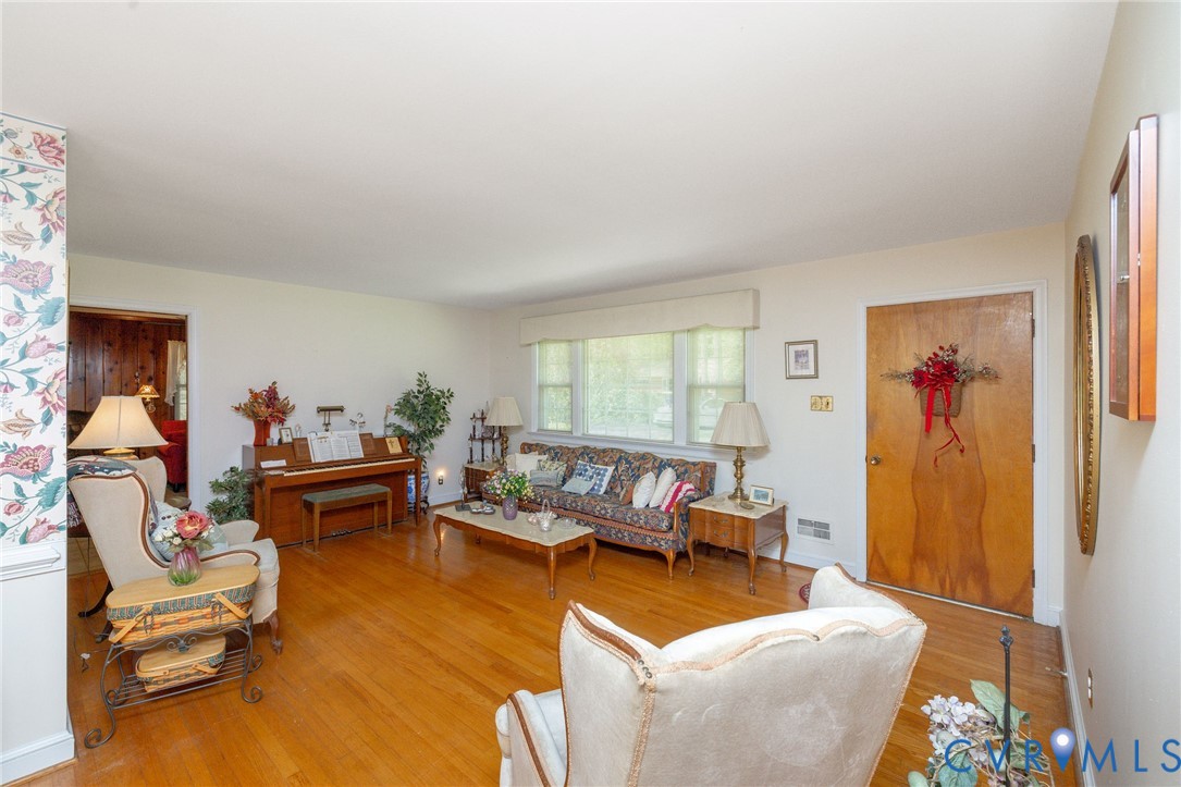 7035 Conifer Road Richmond, VA 23237 - Photo 32 of 38 Living room featuring light wood-style flooring