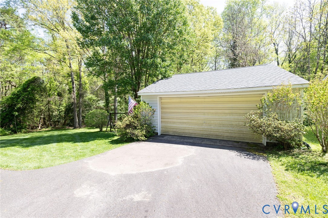 7035 Conifer Road Richmond, VA 23237 - Photo 35 of 38 Detached garage featuring view of scattered trees