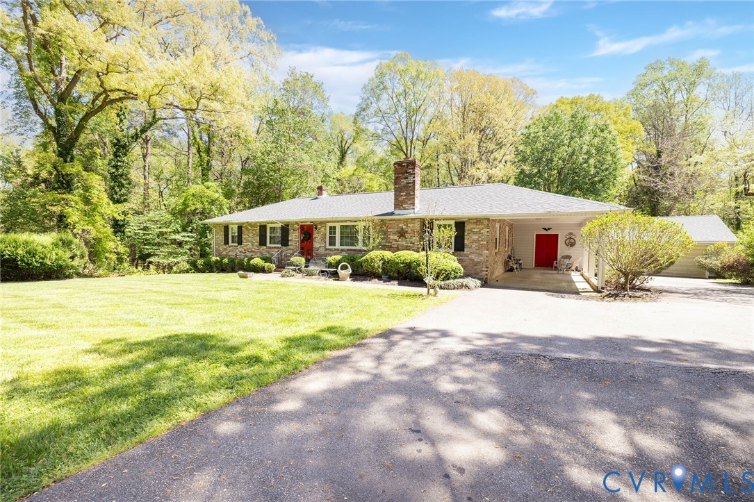 7035 Conifer Road Richmond, VA 23237 - Photo 5 of 38 Ranch-style house featuring driveway, a chimney, a