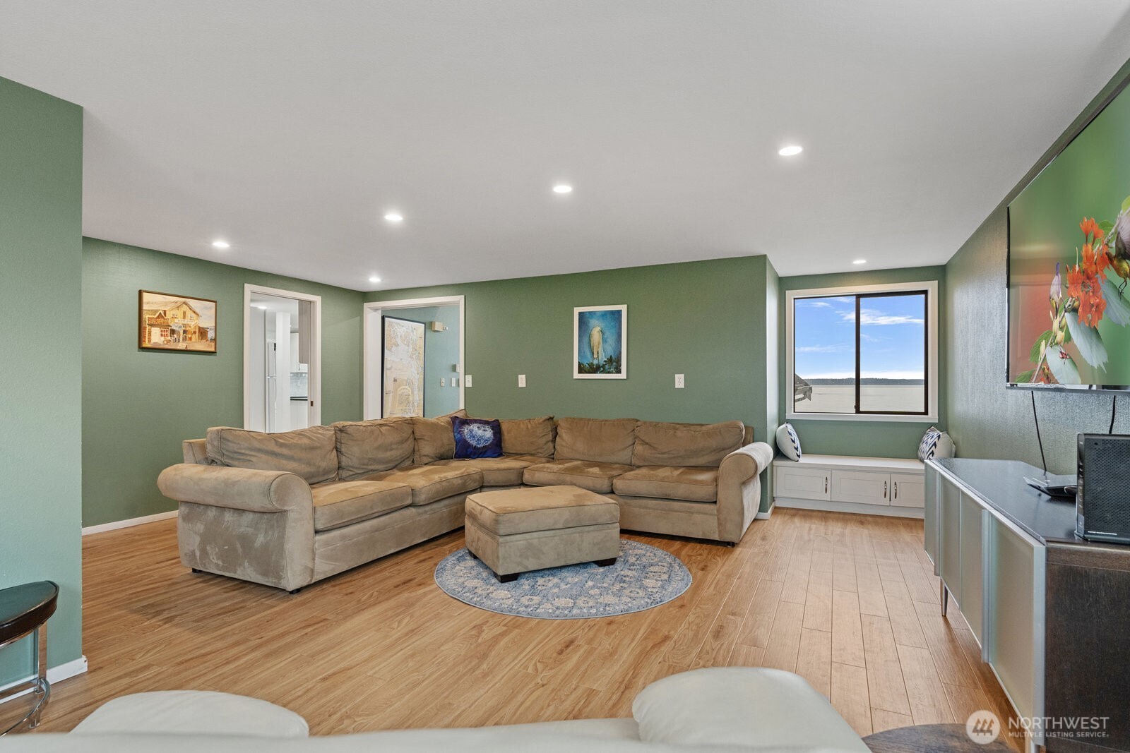 2508 Sunlight Beach Road Clinton, WA 98236 - Photo 12 of 33 a living room with furniture and a flat screen tv