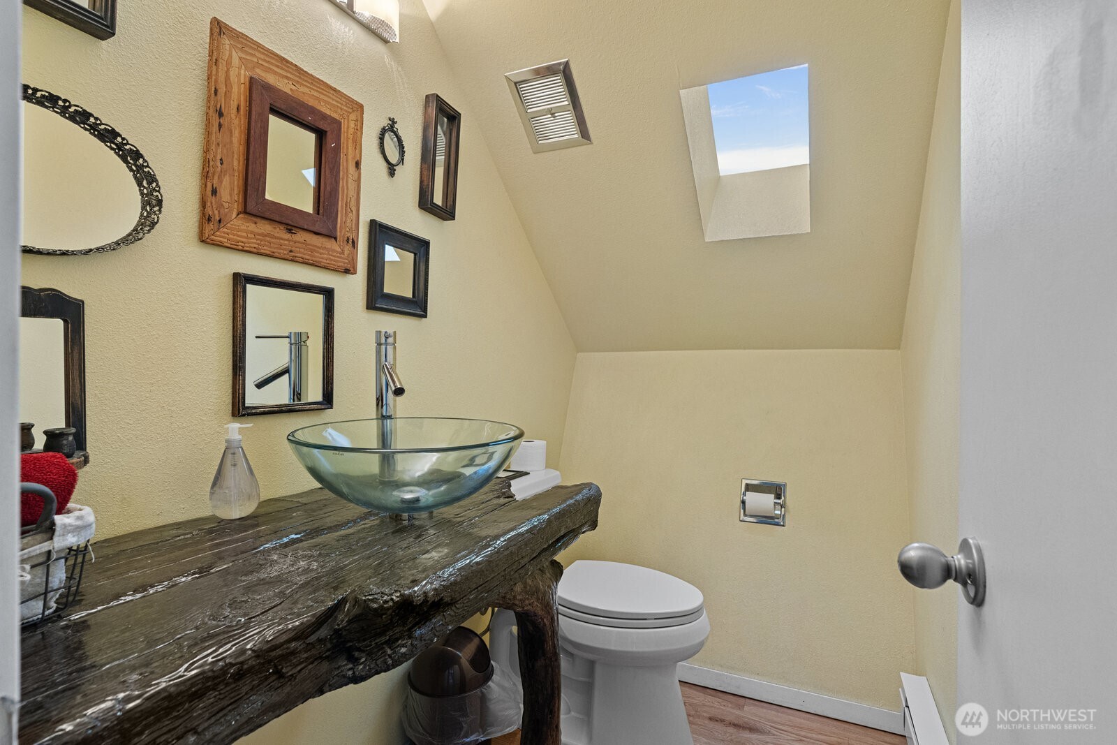 2508 Sunlight Beach Road Clinton, WA 98236 - Photo 14 of 33 a bathroom with a granite countertop toilet and a sink