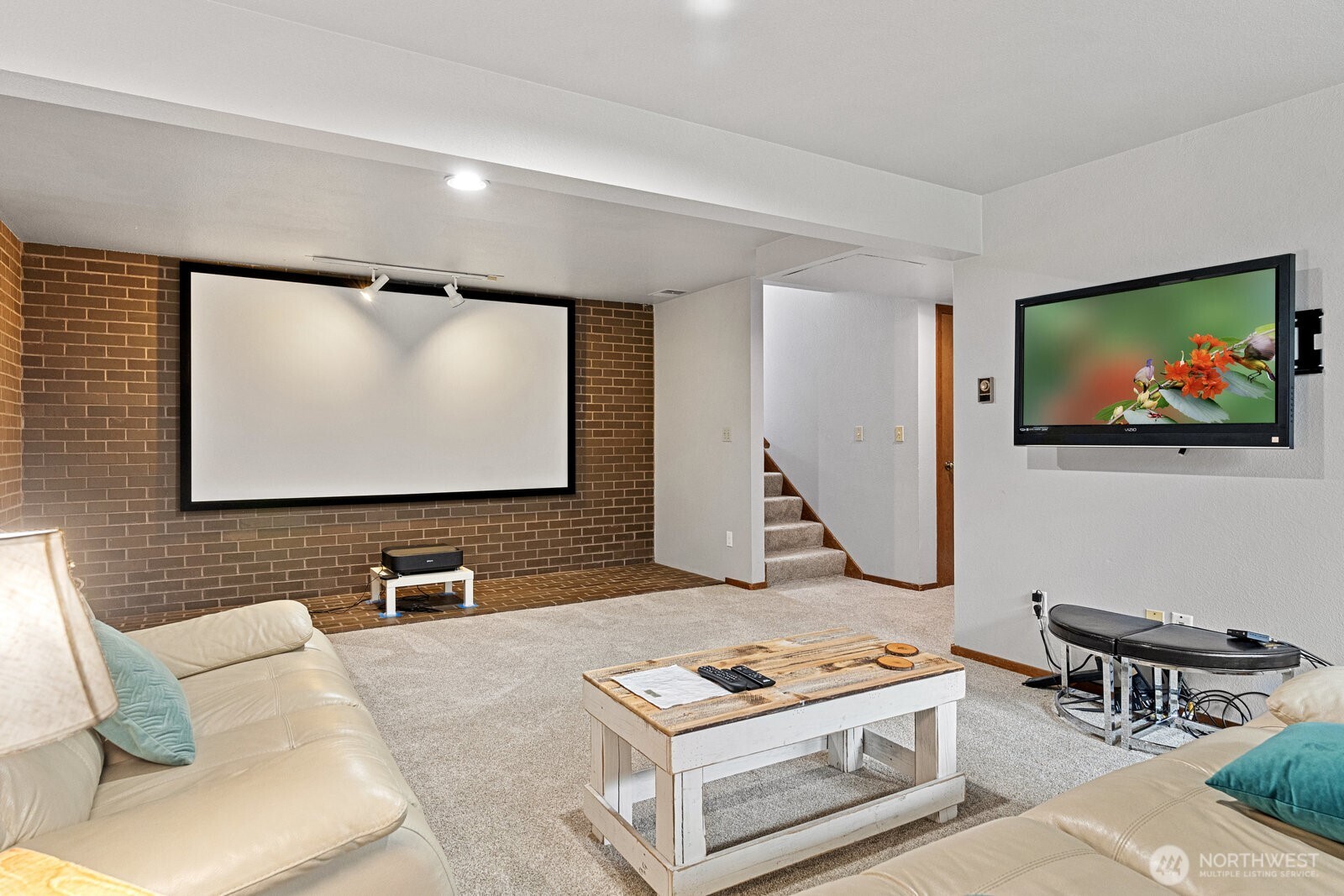2508 Sunlight Beach Road Clinton, WA 98236 - Photo 20 of 33 a living room with furniture and a flat screen tv