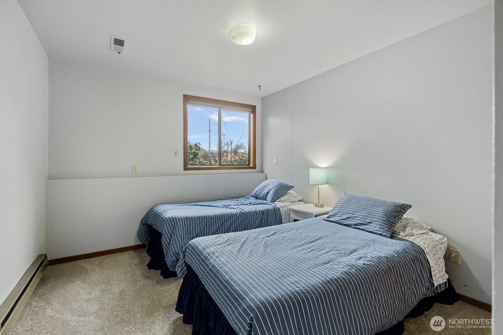 2508 Sunlight Beach Road Clinton, WA 98236 - Photo 21 of 33 a bedroom with two beds and a window