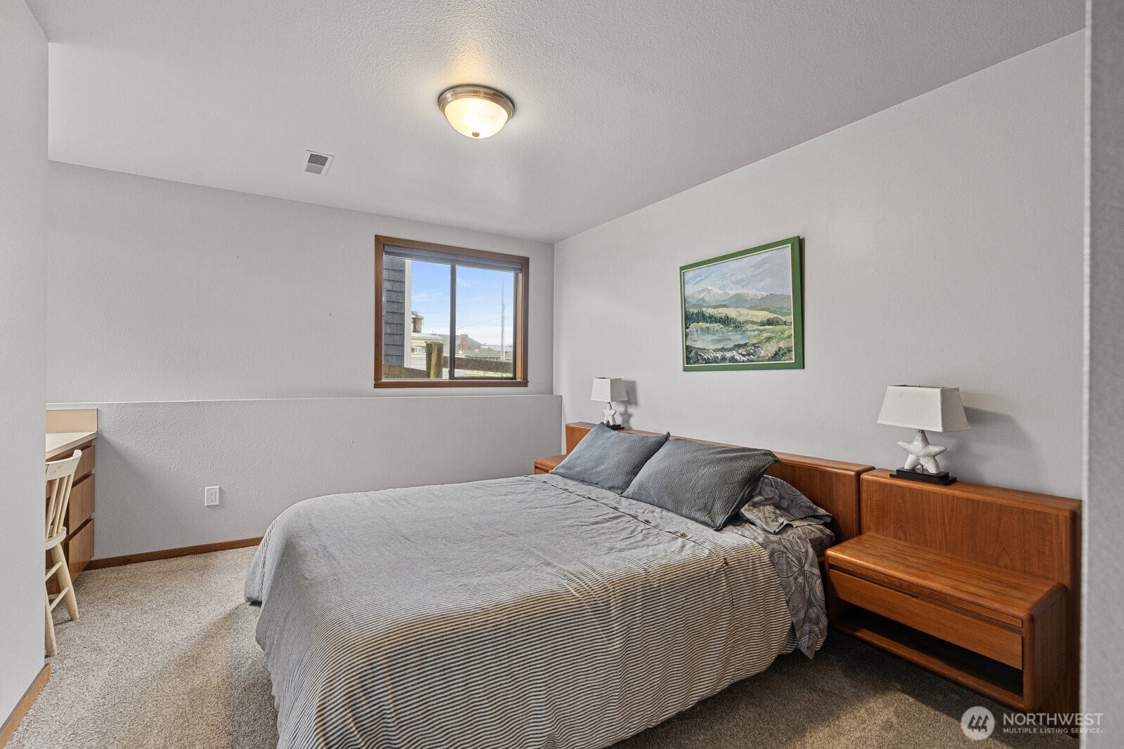 2508 Sunlight Beach Road Clinton, WA 98236 - Photo 24 of 33 a bedroom with a bed and a window