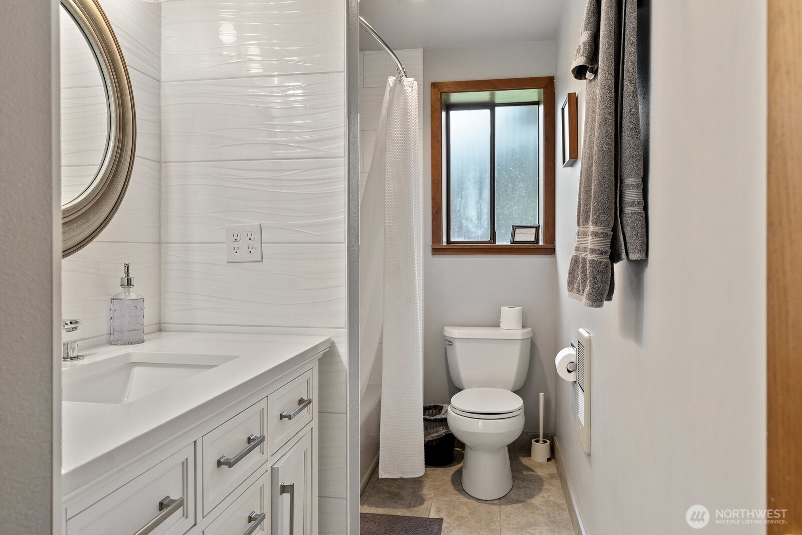 2508 Sunlight Beach Road Clinton, WA 98236 - Photo 25 of 33 a bathroom with a toilet sink and mirror