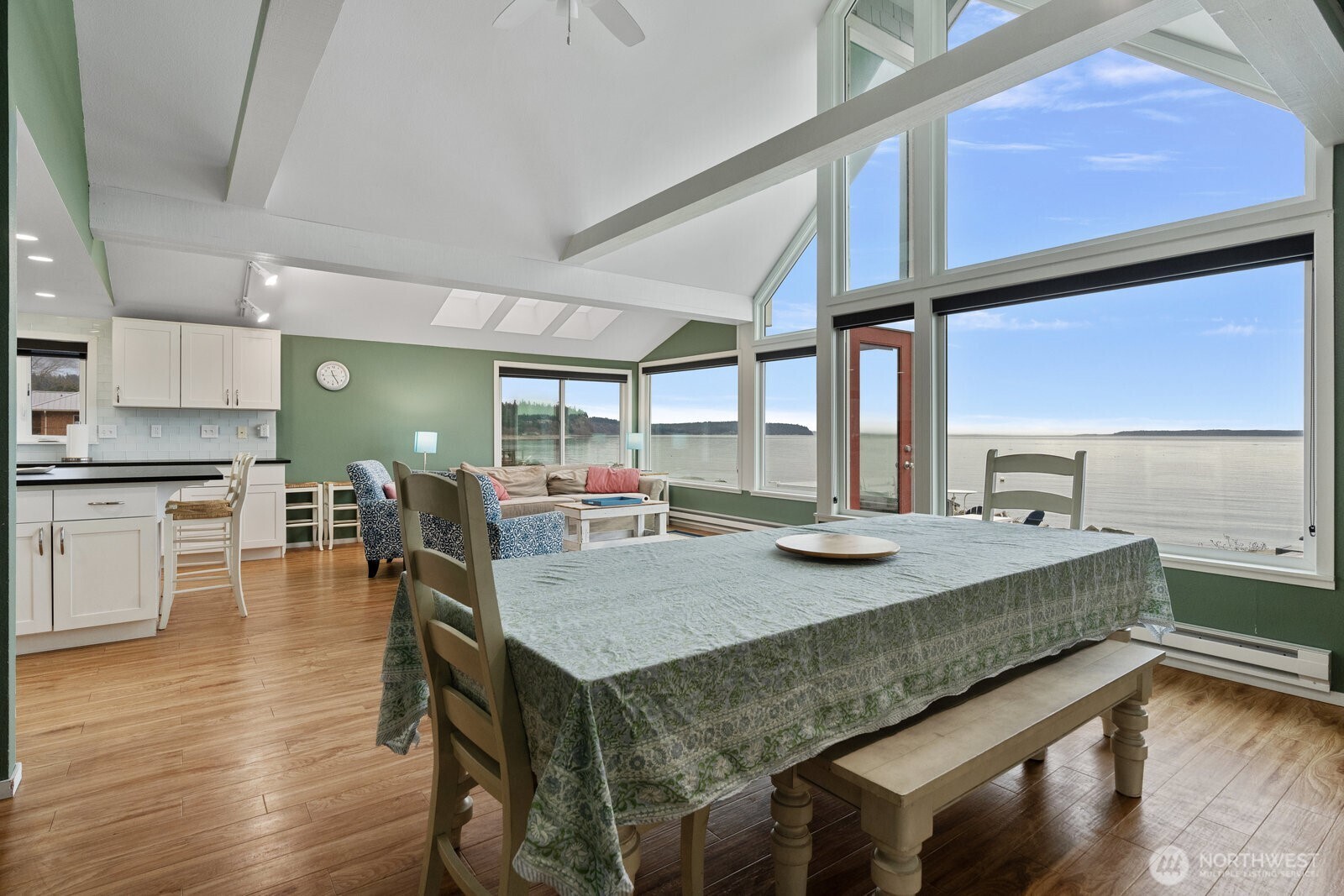 2508 Sunlight Beach Road Clinton, WA 98236 - Photo 8 of 33 a kitchen with a table chairs and wooden floor