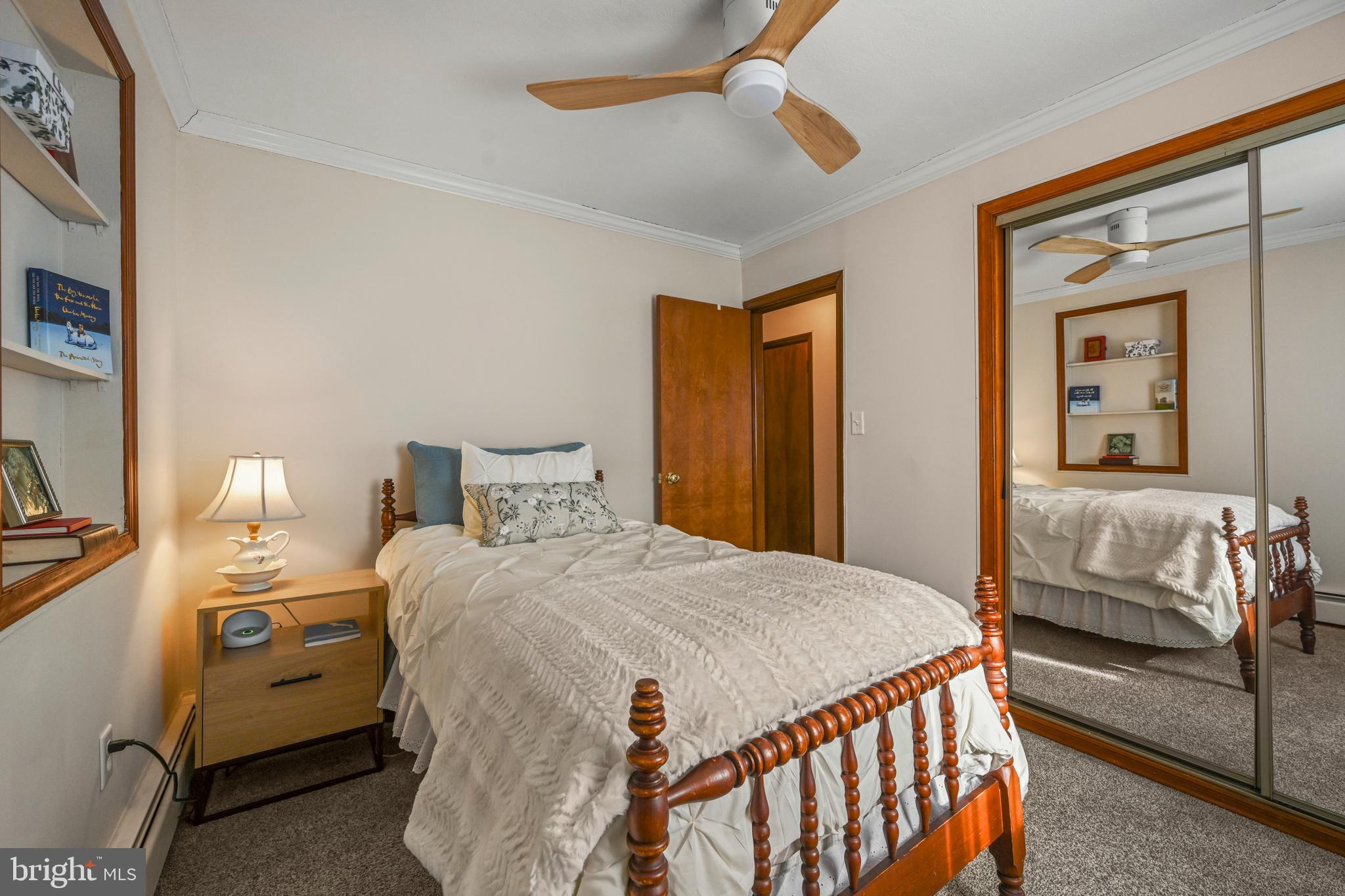 1027 Upton Road Glen Burnie, MD 21060 - Photo 11 of 39 a bedroom with a bed and a chandelier