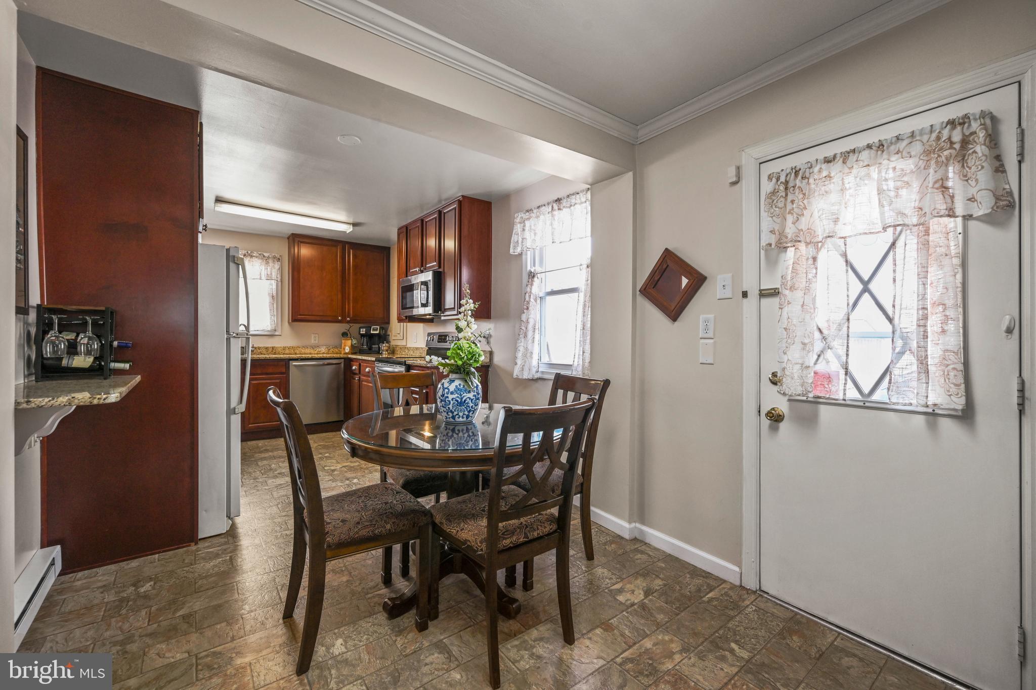 1027 Upton Road Glen Burnie, MD 21060 - Photo 14 of 39 a view of a dining room with furniture and a window