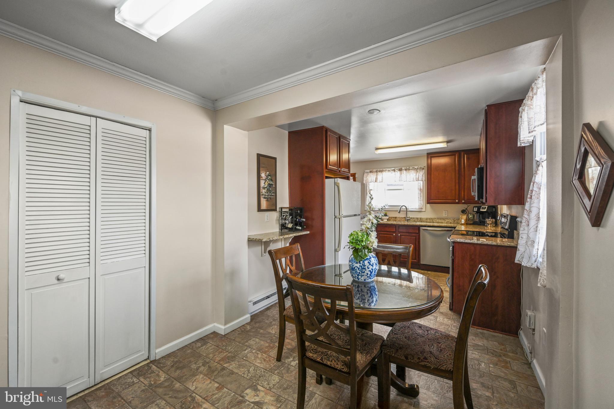 1027 Upton Road Glen Burnie, MD 21060 - Photo 15 of 39 a view of a dining room with furniture
