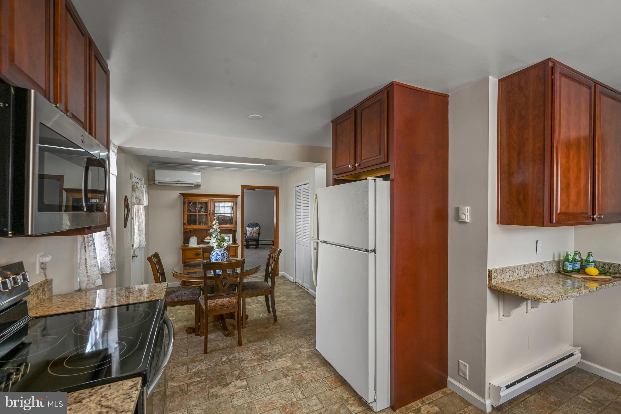 1027 Upton Road Glen Burnie, MD 21060 - Photo 19 of 39 a view of kitchen with furniture and refrigerator