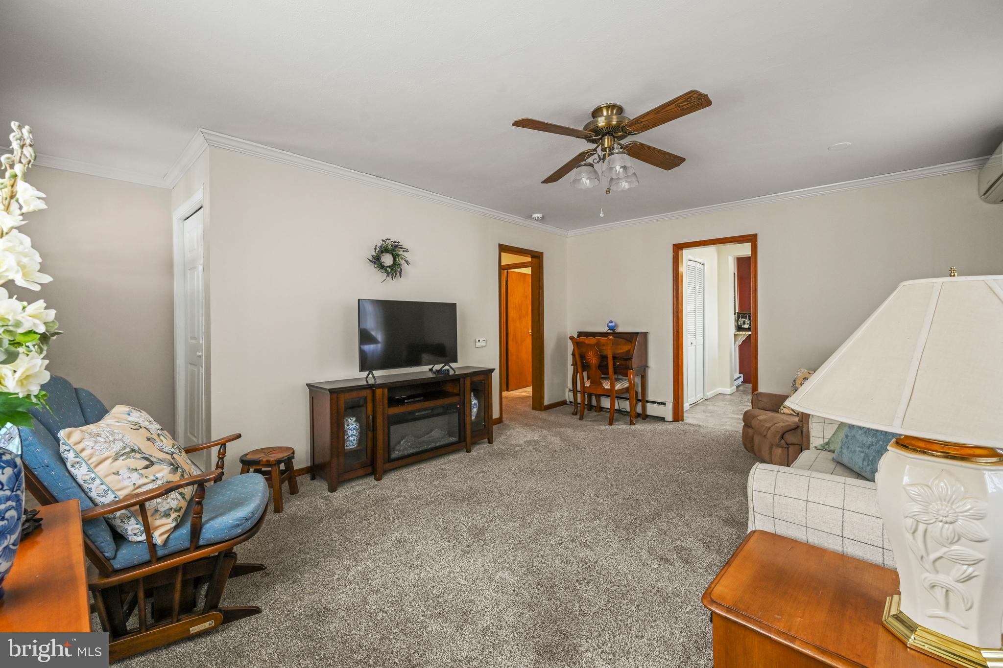 1027 Upton Road Glen Burnie, MD 21060 - Photo 5 of 39 a living room with furniture and a flat screen tv