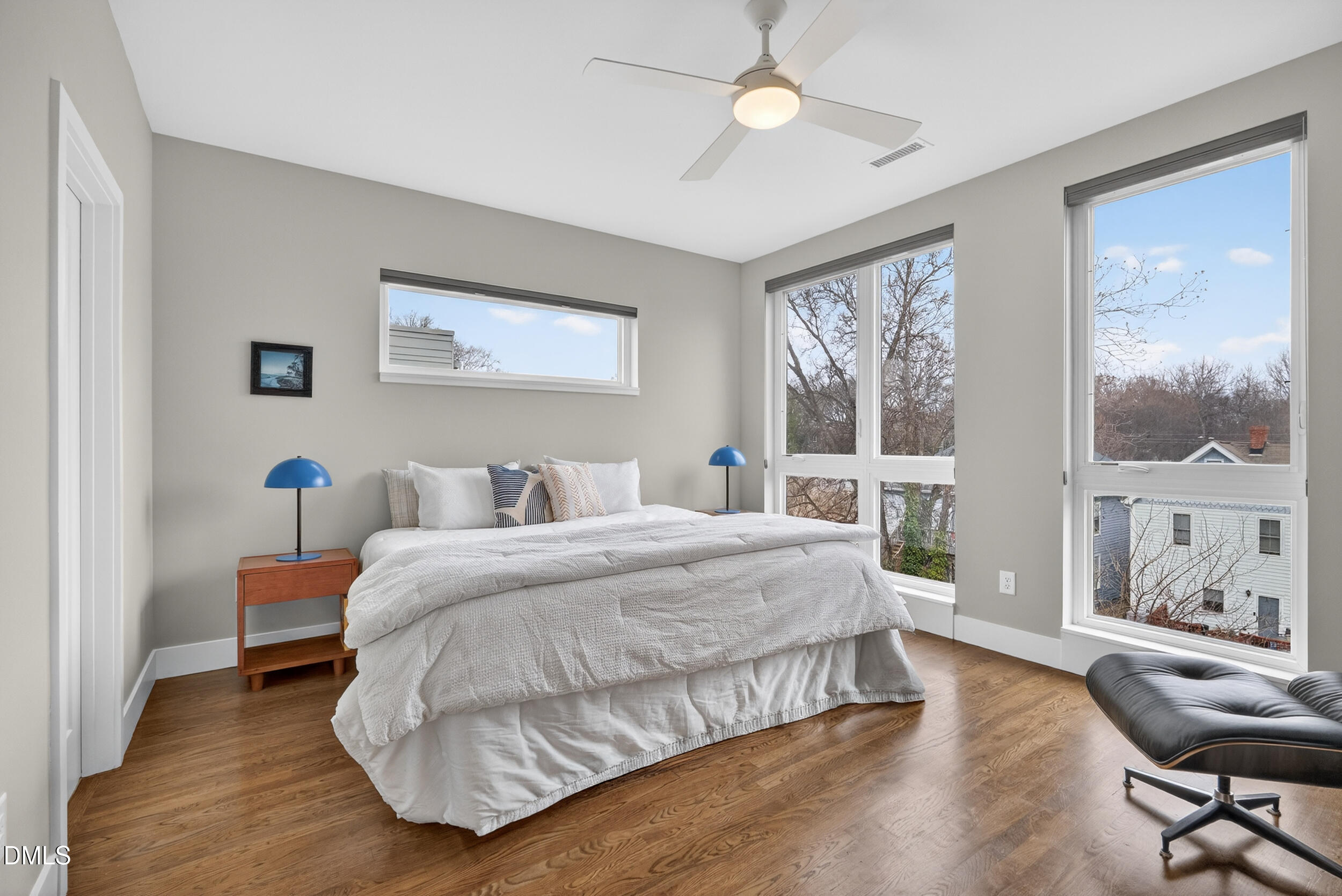 537 New Bern Avenue, Unit 101 Raleigh, NC 27601 - Photo 14 of 34 a spacious bedroom with a large bed and a large window