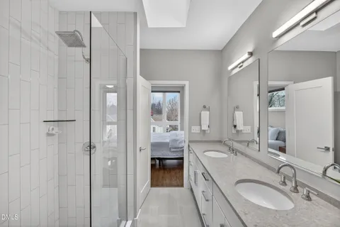 a bedroom with a bed and a night stand