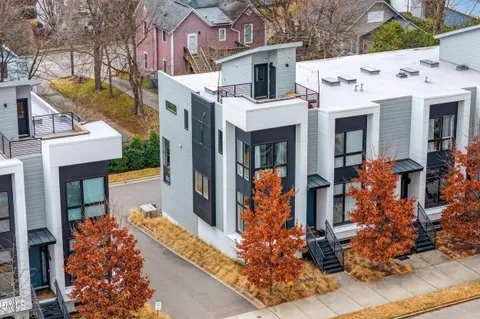 an aerial view of a house with roof deck