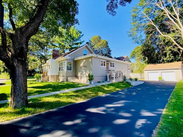 a front view of a house with a yard