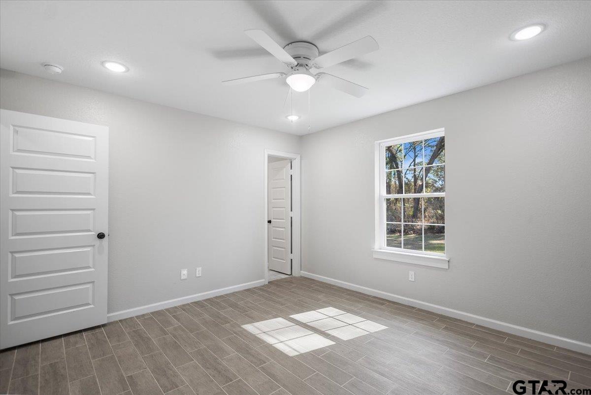 234 Sabinal Street Bullard, TX 75757 - Photo 19 of 30 an empty room with windows and closet