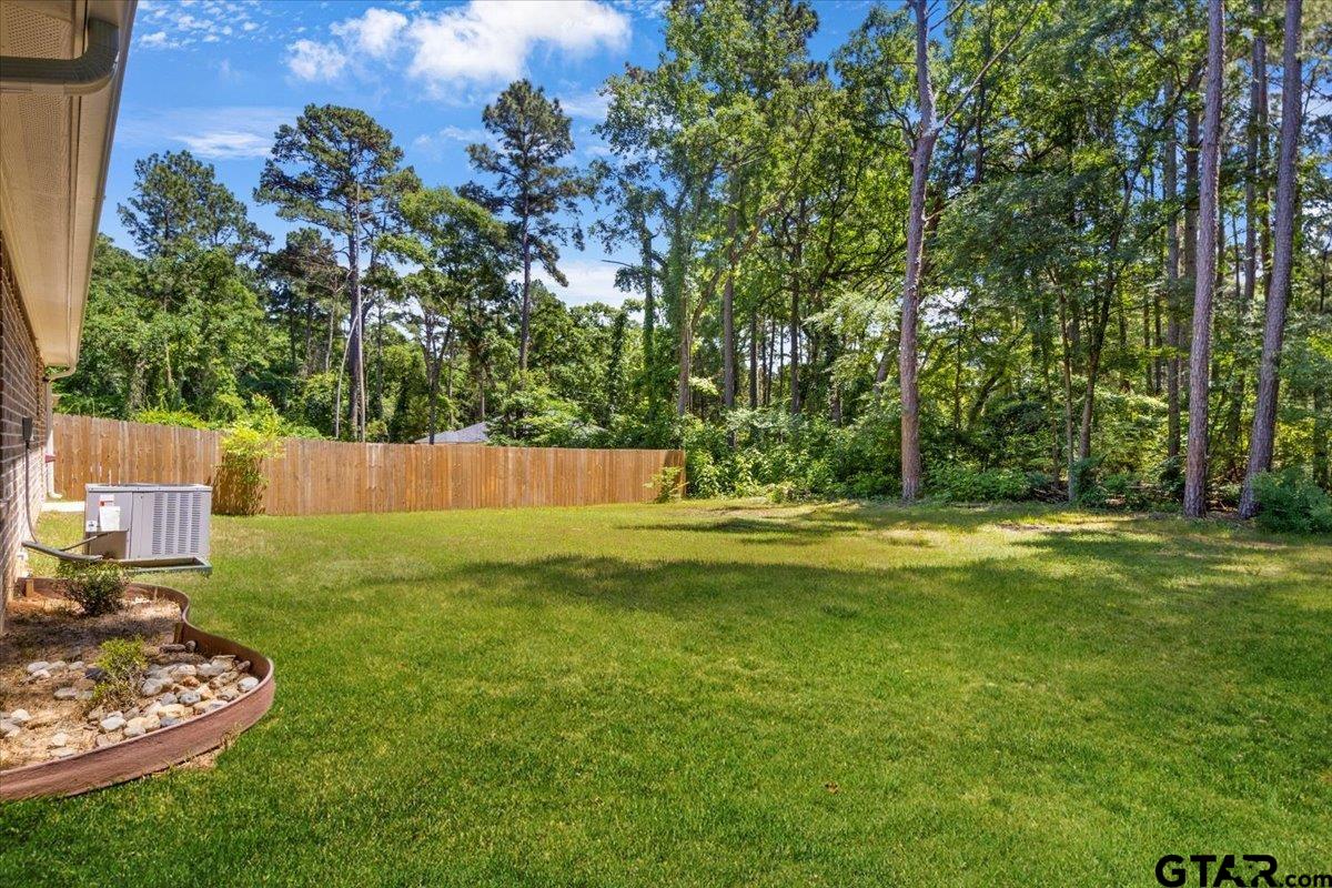 234 Sabinal Street Bullard, TX 75757 - Photo 26 of 30 a view of a backyard with a garden and entertaining space