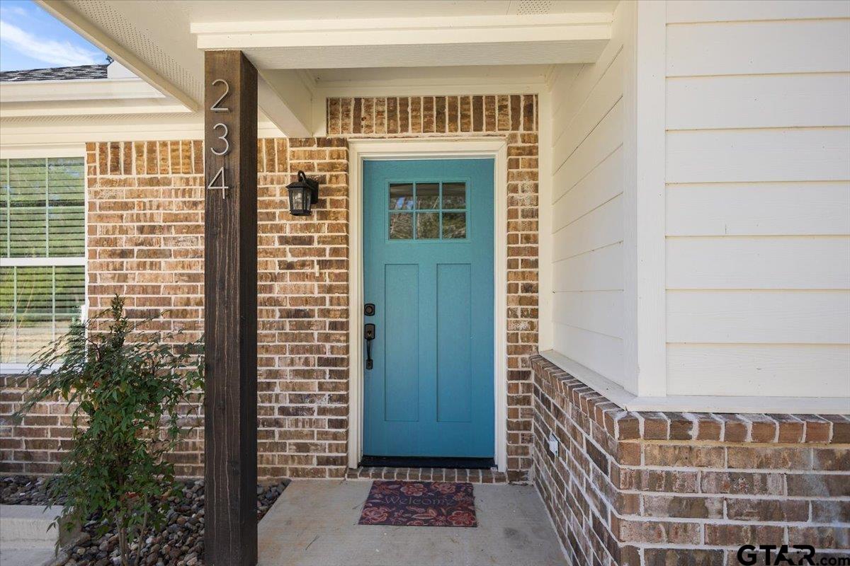 234 Sabinal Street Bullard, TX 75757 - Photo 5 of 30 a view of a door with a door and a window
