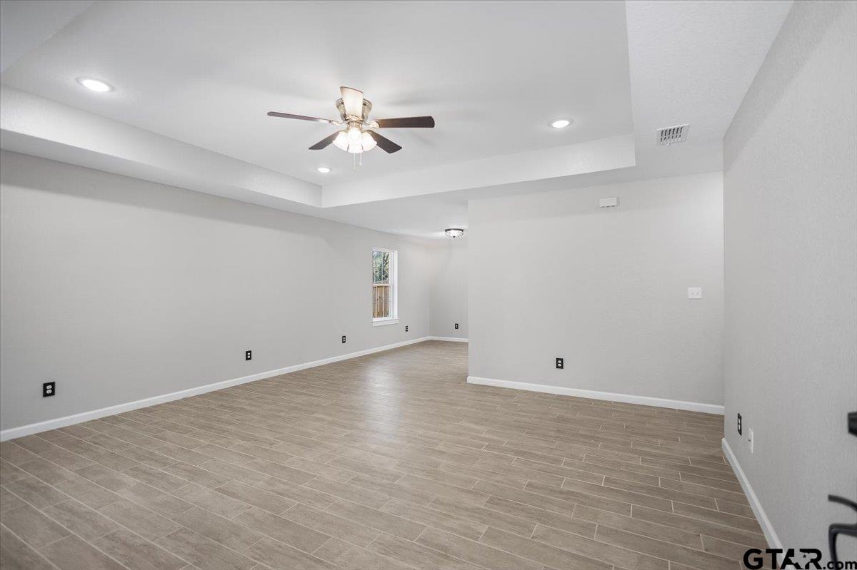 234 Sabinal Street Bullard, TX 75757 - Photo 6 of 30 wooden floor in an empty room with a window