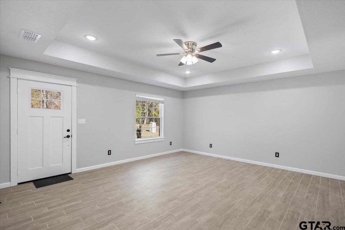 234 Sabinal Street Bullard, TX 75757 - Photo 7 of 30 wooden floor in an empty room with a window