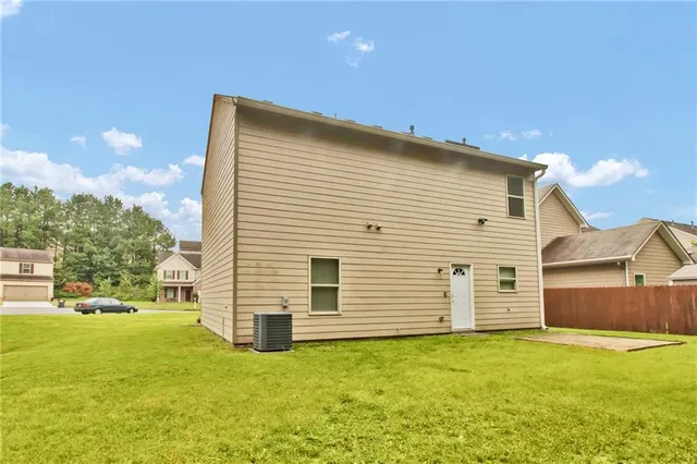 a view of a backyard of the house