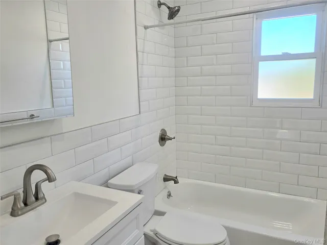 a bathroom with a sink and a bathtub