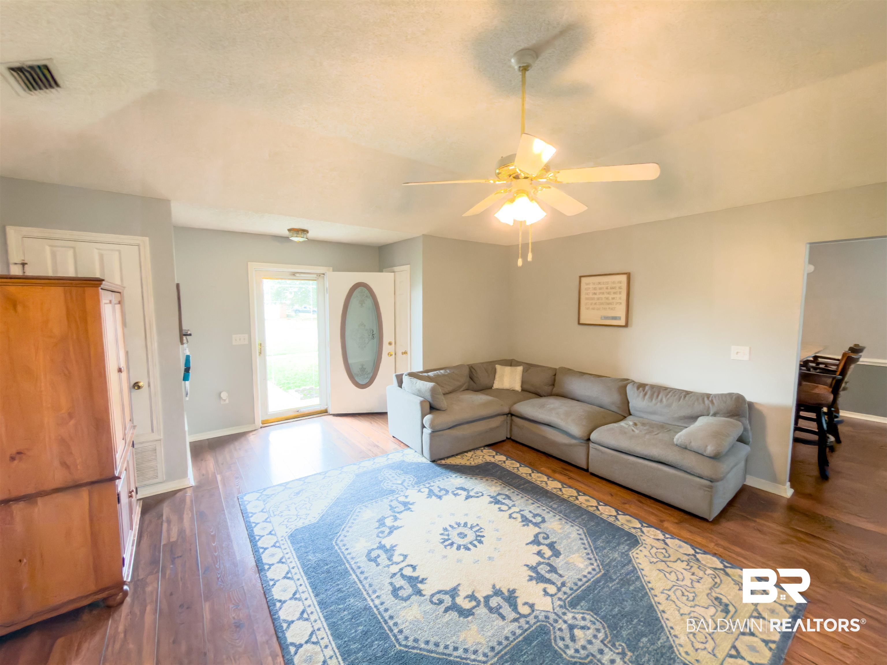 129 Pennbrooke Loop Foley, AL 36535 - Photo 6 of 44 Living room with dark wood-type flooring, ceiling fan, and a textured ceiling