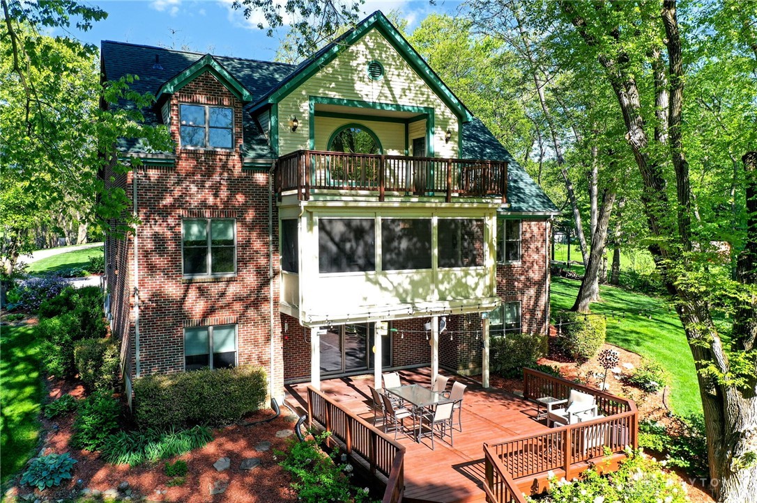 330 South Alpha Bellbrook Road Bellbrook, OH 45305 - Photo 77 of 87 This home features a brick exterior, multiple balconies, and a spacious deck for outdoor living.