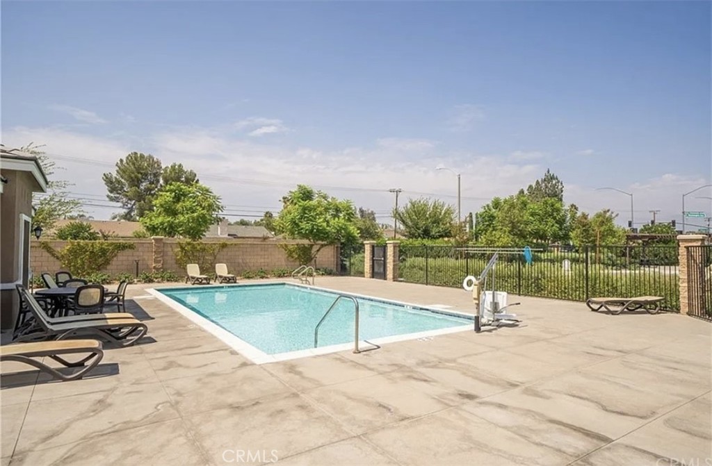 a view of a swimming pool with a lounge chair