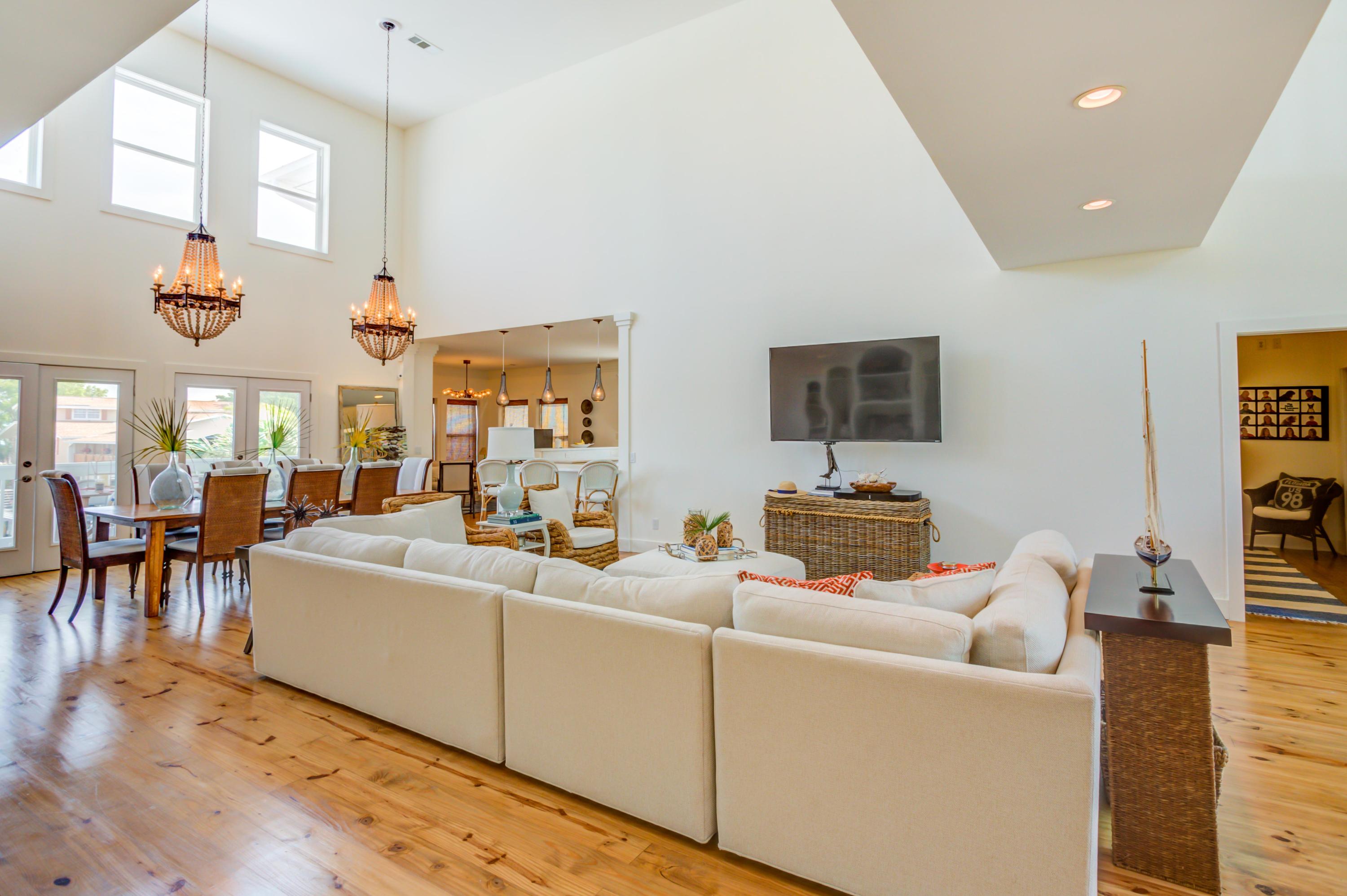 523 Gulf Shore Drive Destin, FL 32541 - Photo 12 of 78 a living room with furniture a flat screen tv and a window