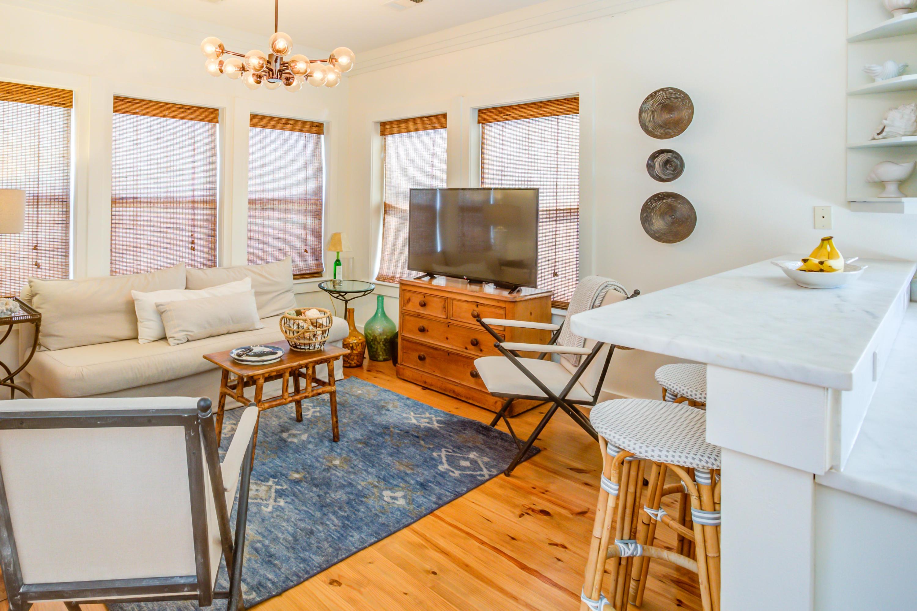 523 Gulf Shore Drive Destin, FL 32541 - Photo 19 of 78 a living room with furniture and a flat screen tv