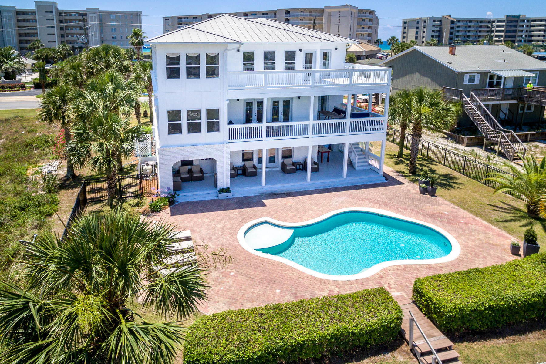 523 Gulf Shore Drive Destin, FL 32541 - Photo 2 of 78 a view of a swimming pool with outdoor seating and plants